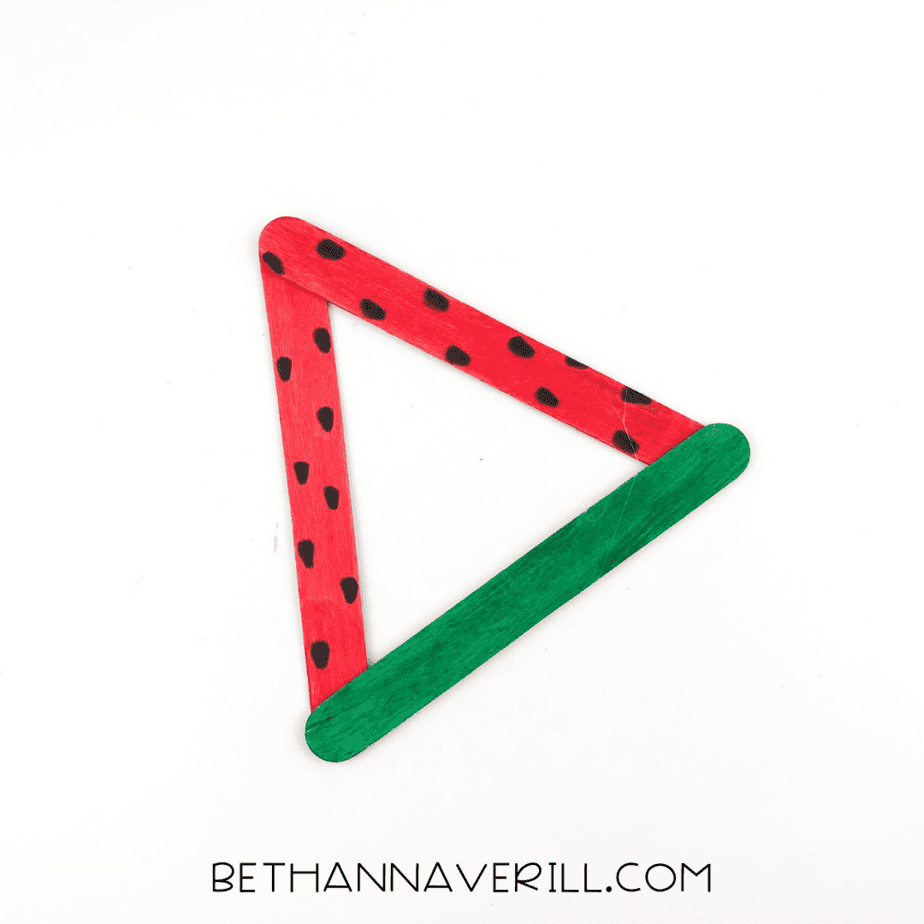 Finished watermelon craft with black seeds added.
