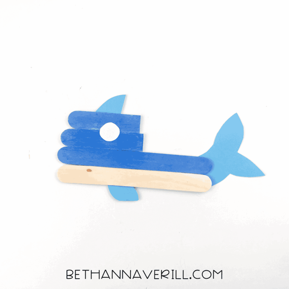 Construction paper parts glued to the whale’s stick body.