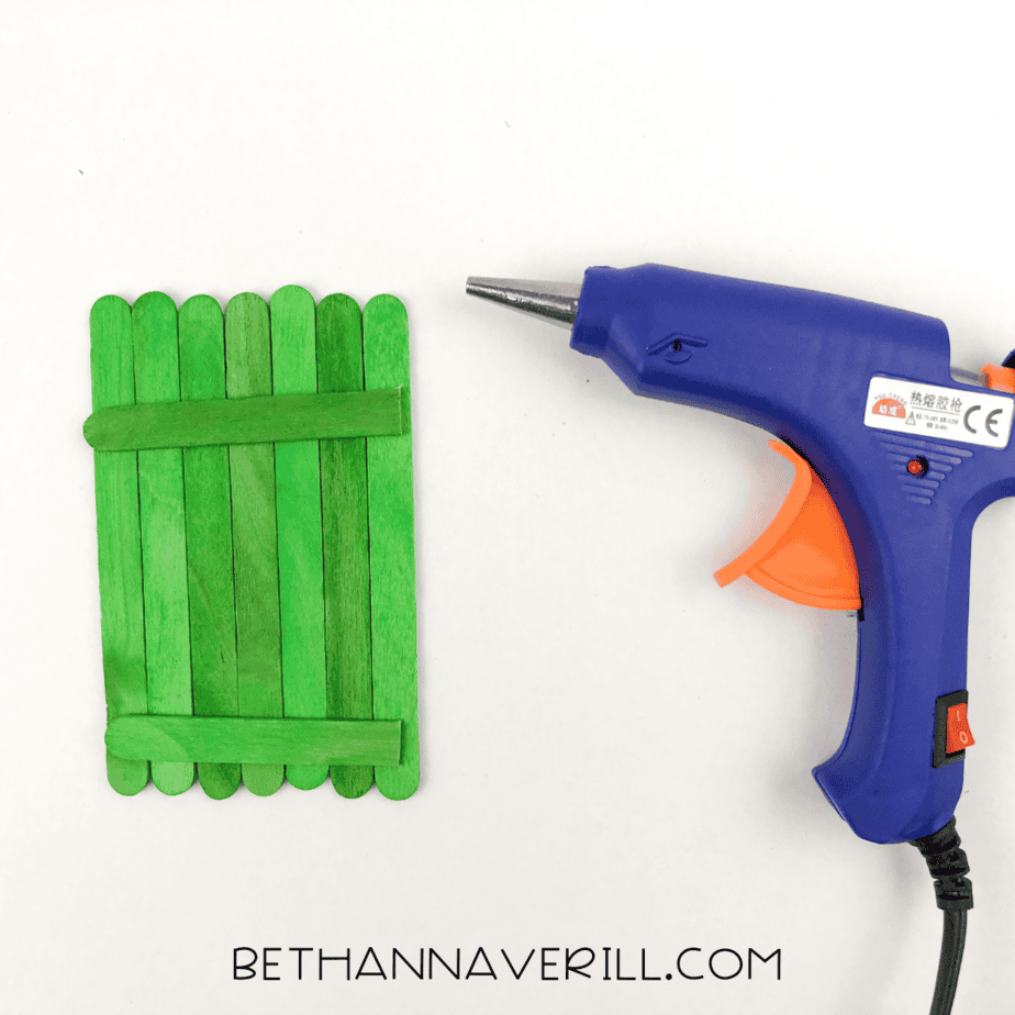 popsicle sticks glued together using hot glue