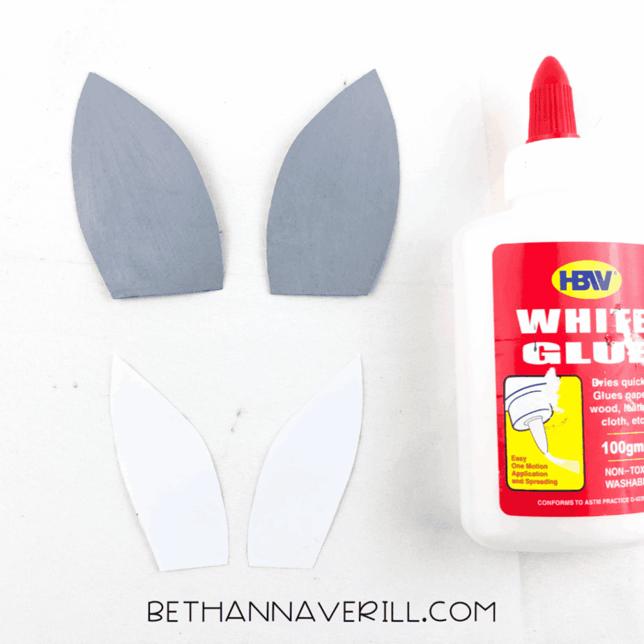 Gray ears with white inner ear pieces and glue