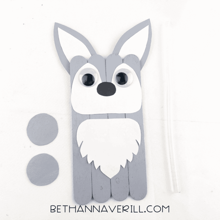 Two gray circles cut for the wolf paws