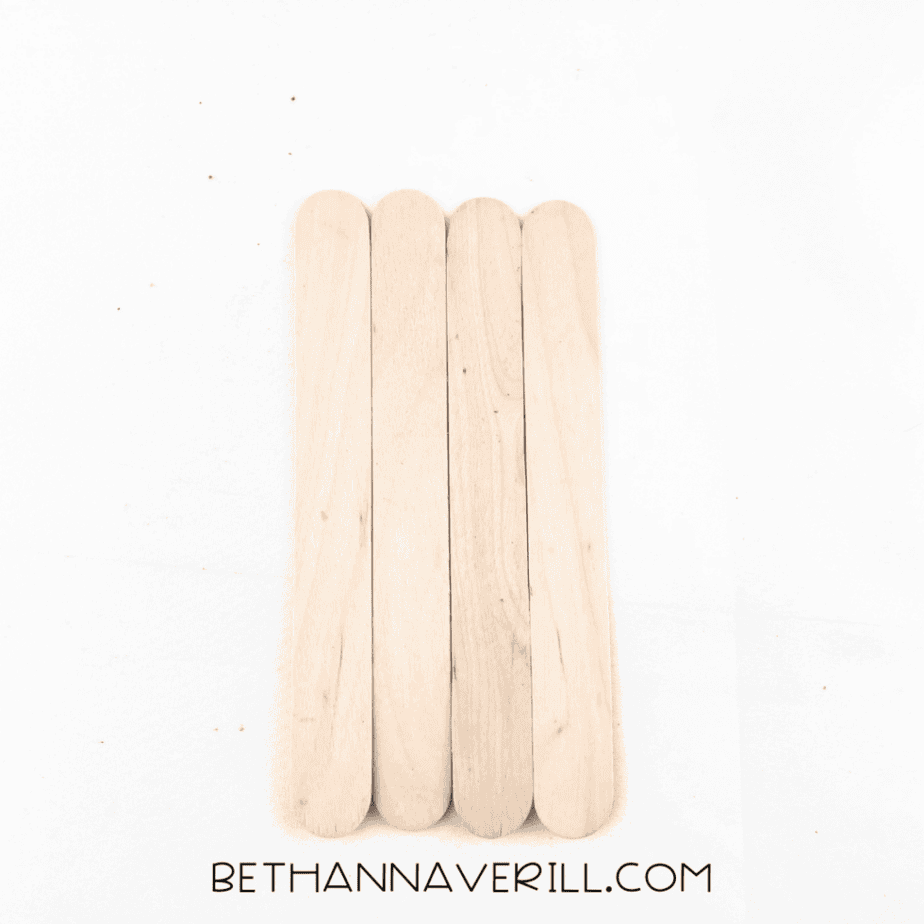 Four craft sticks glued together side by side