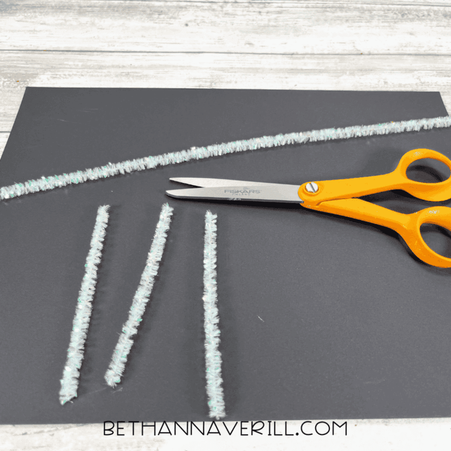 Pipe cleaners cut into short pieces for cat whiskers.