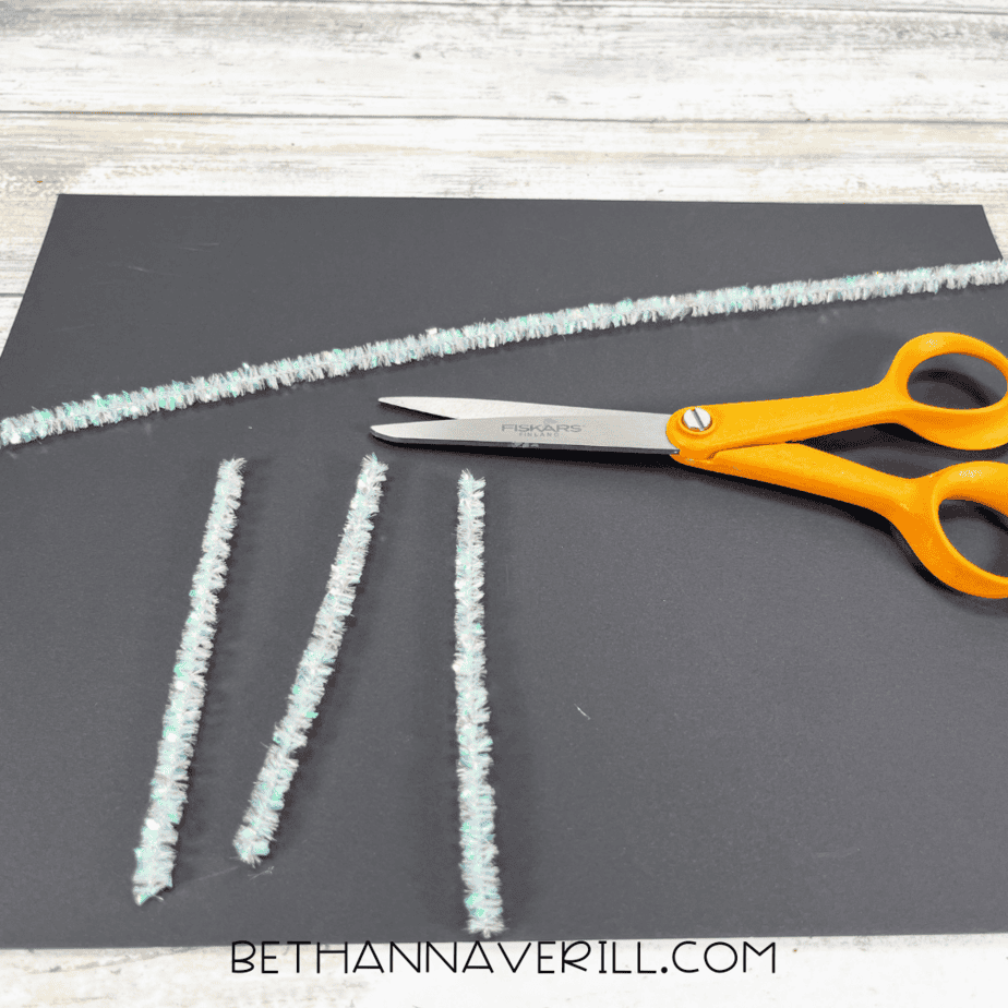 Pipe cleaners cut into short pieces for cat whiskers.