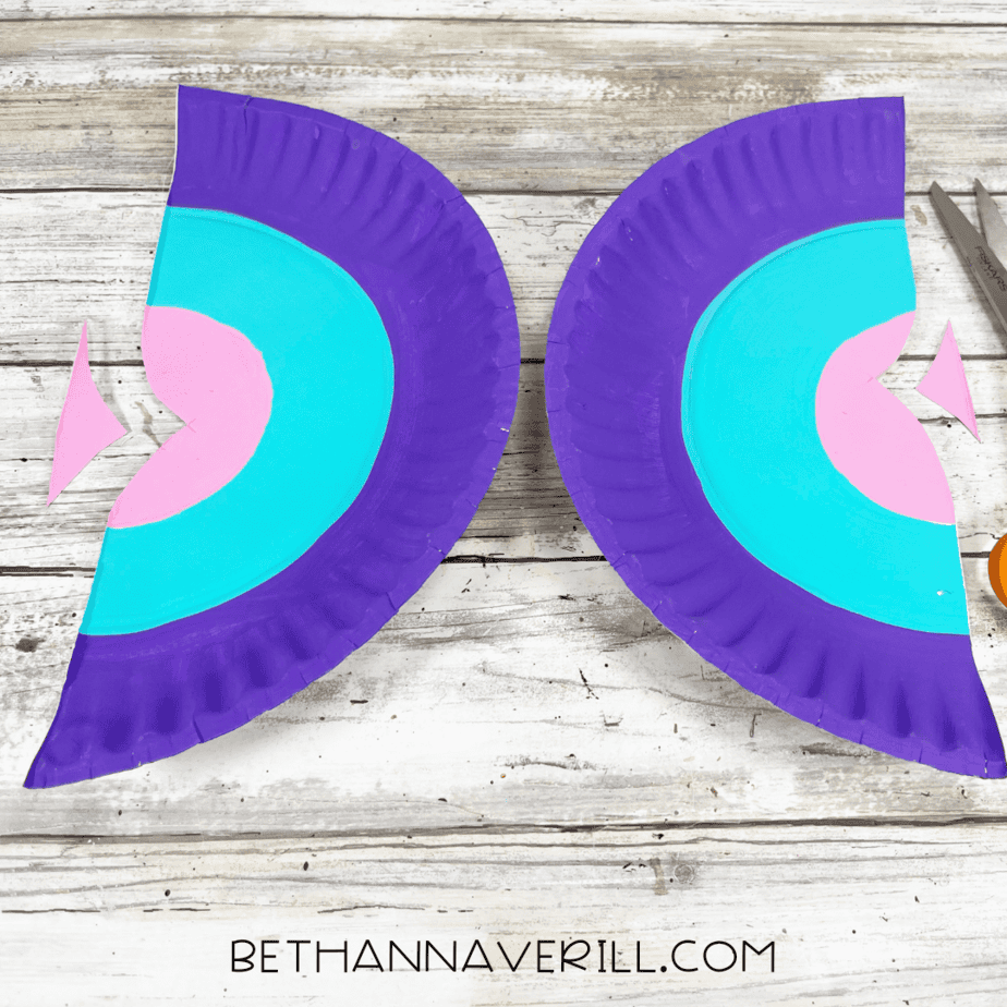 Butterfly wings cut from the paper plate with notches in the middle.