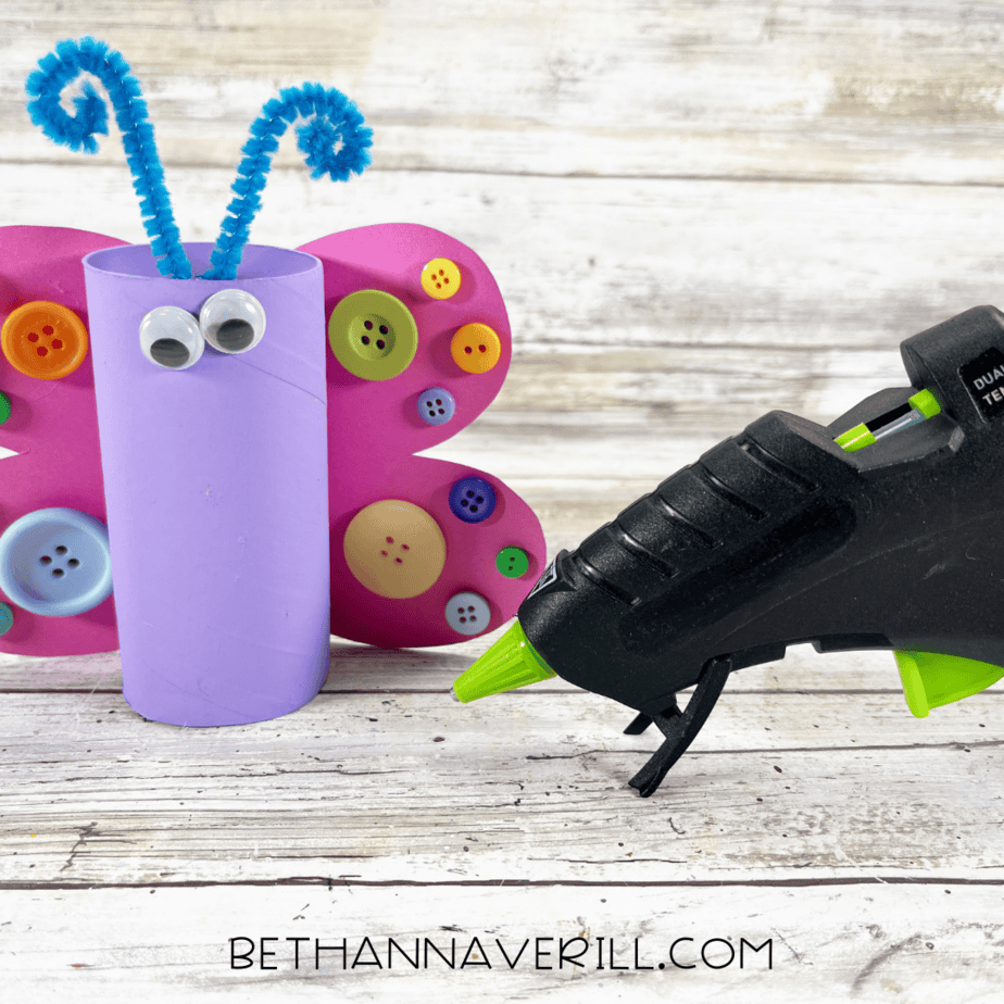 Purple butterfly roll with googly eyes and blue pipe cleaner antennae glued on.