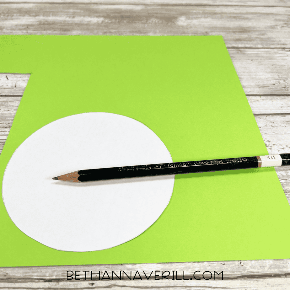 Circle template traced onto green construction paper with pencil.