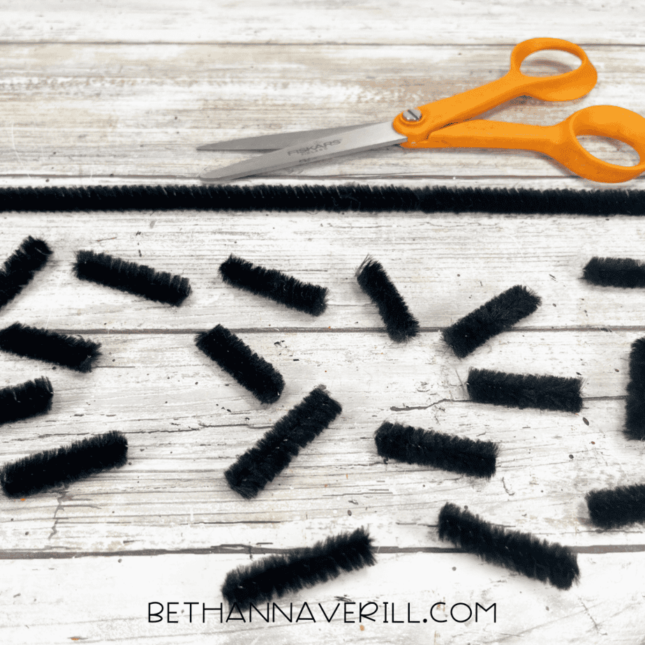 Black pipe cleaners cut into short pieces for caterpillar legs.