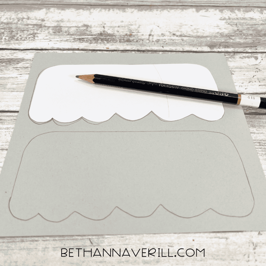 Ornament top template traced onto gray cardstock with a pencil.