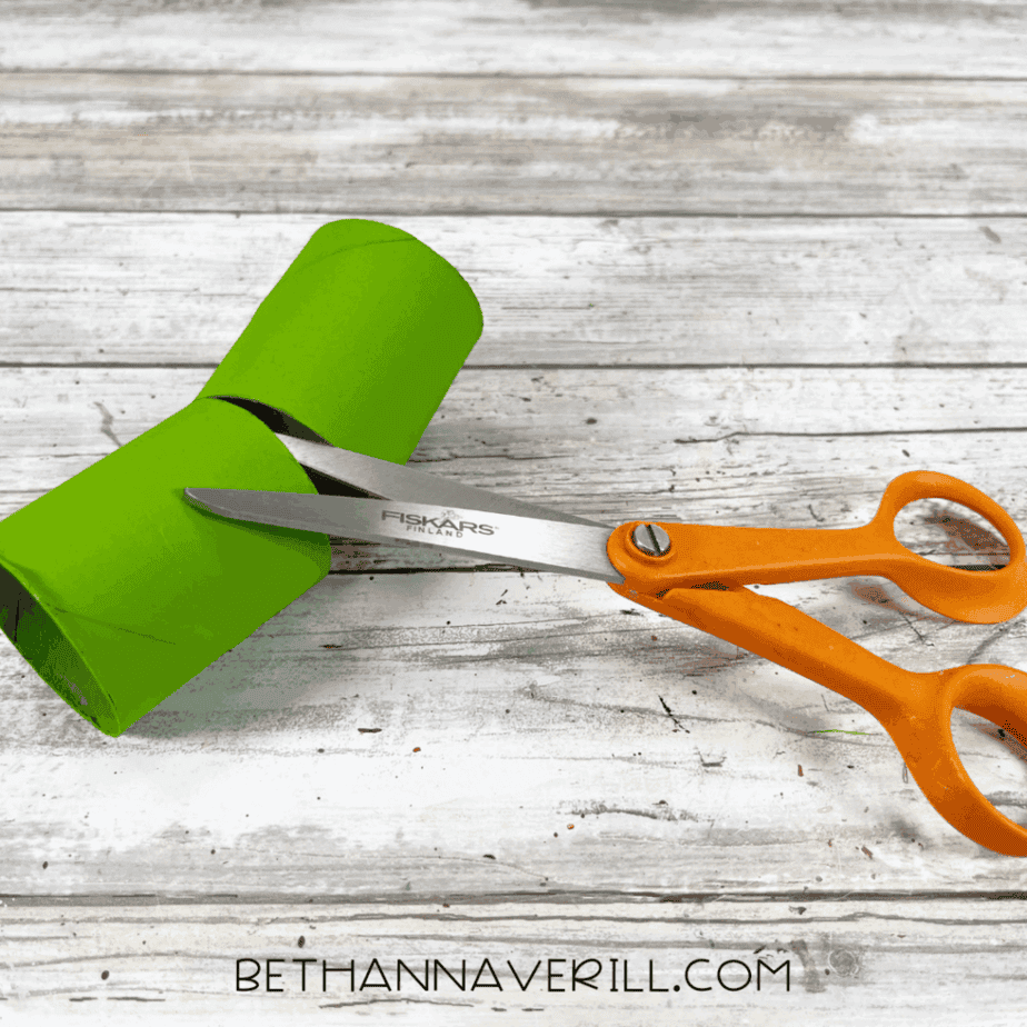 Green cardboard tubes cut into two short legs.