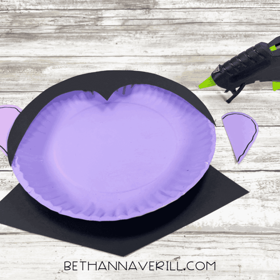 Dracula paper plate with black hair and cape glued on