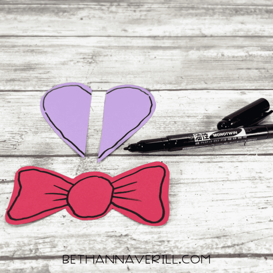 Purple ears and red bow tie with black marker details