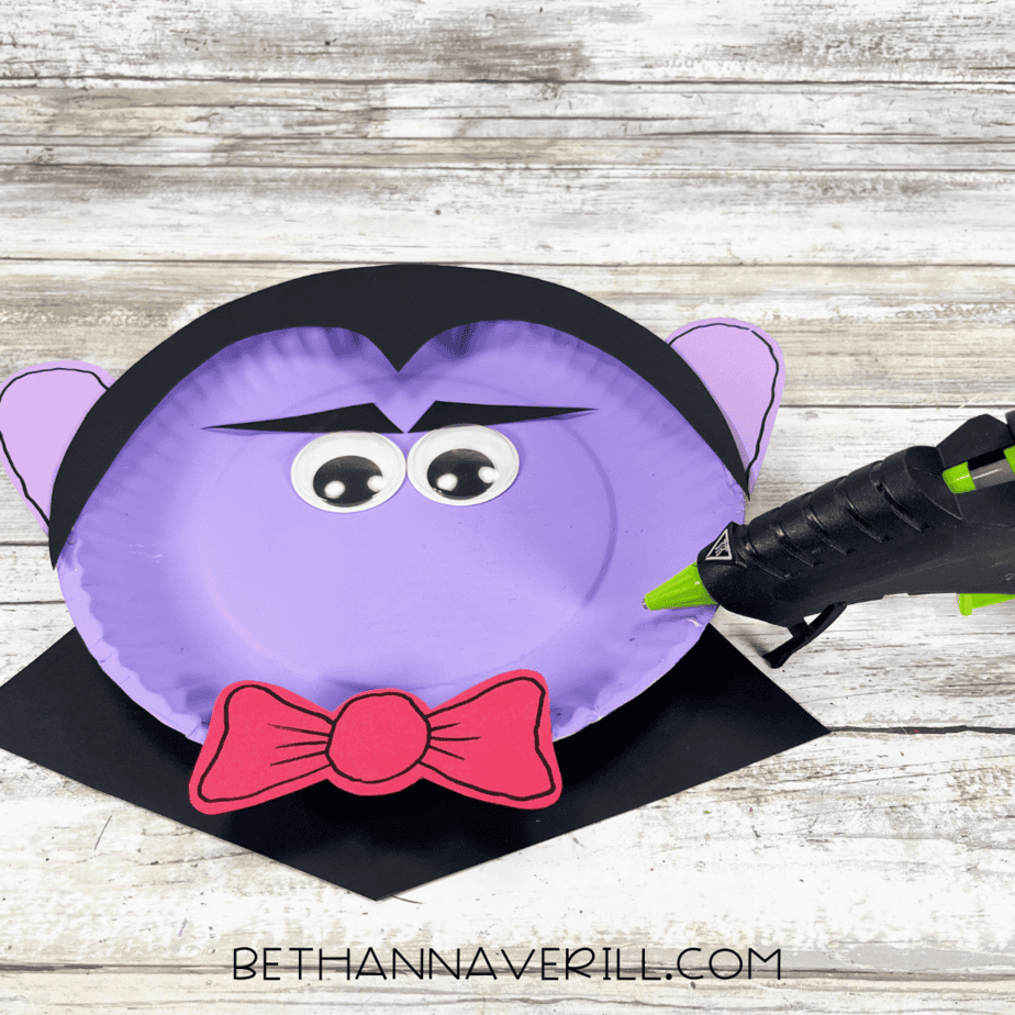 bow tie, eyes, and eyebrows glued on to dracula