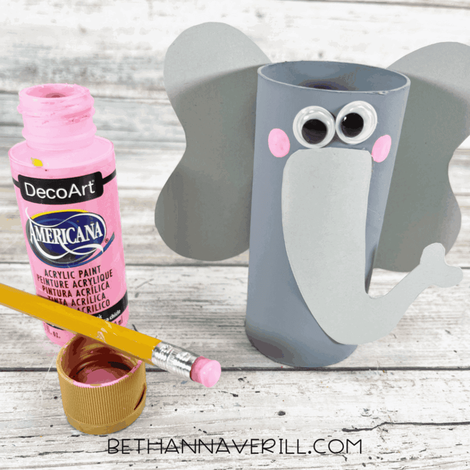 Elephant paper roll craft with ears, trunk, and pink painted cheeks.