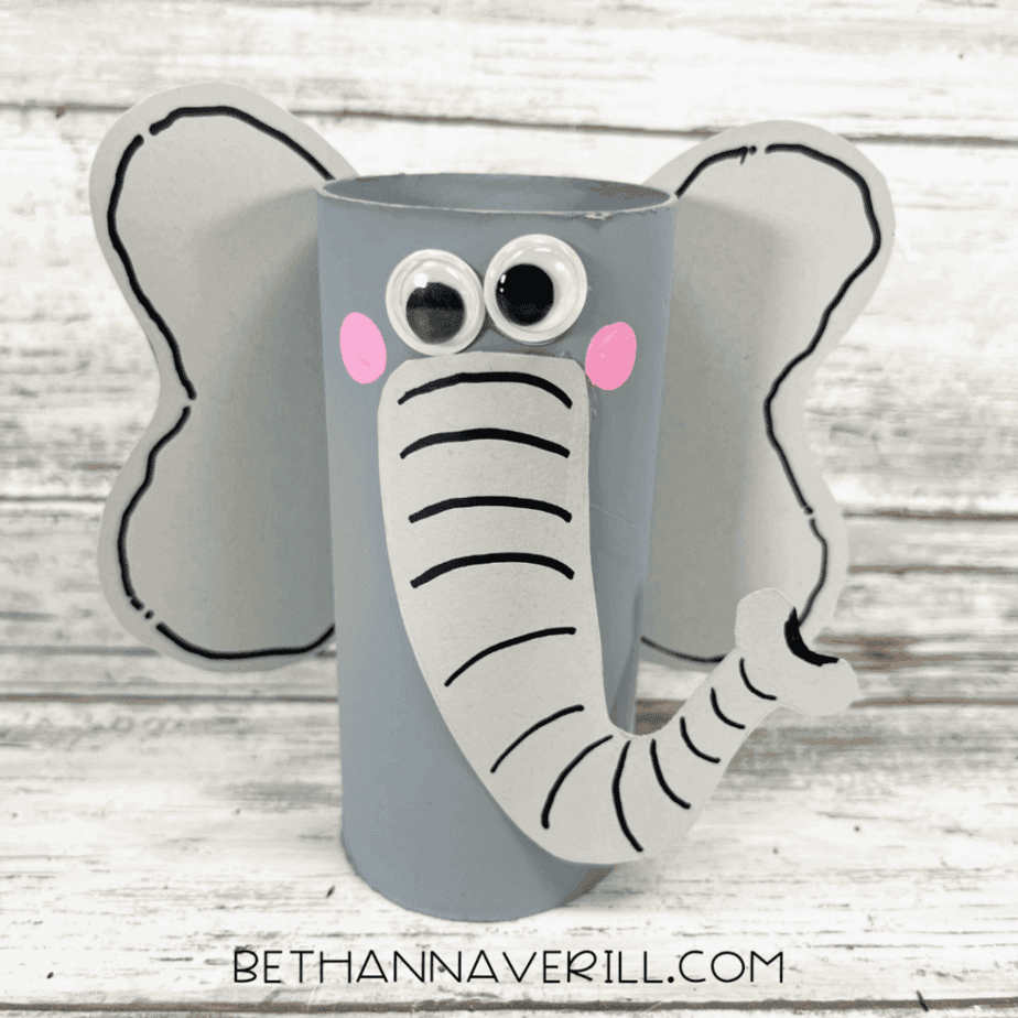 Finished elephant paper roll craft with googly eyes, pink cheeks, and outlined ears.
