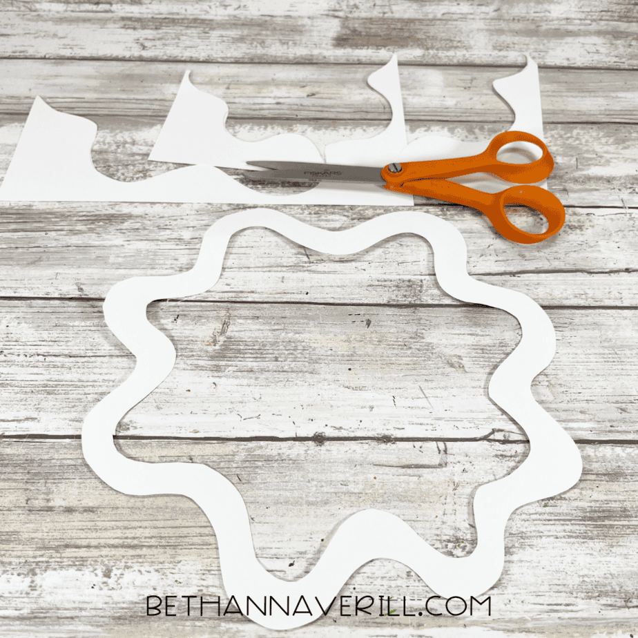White wavy icing trim cut out with scissors.