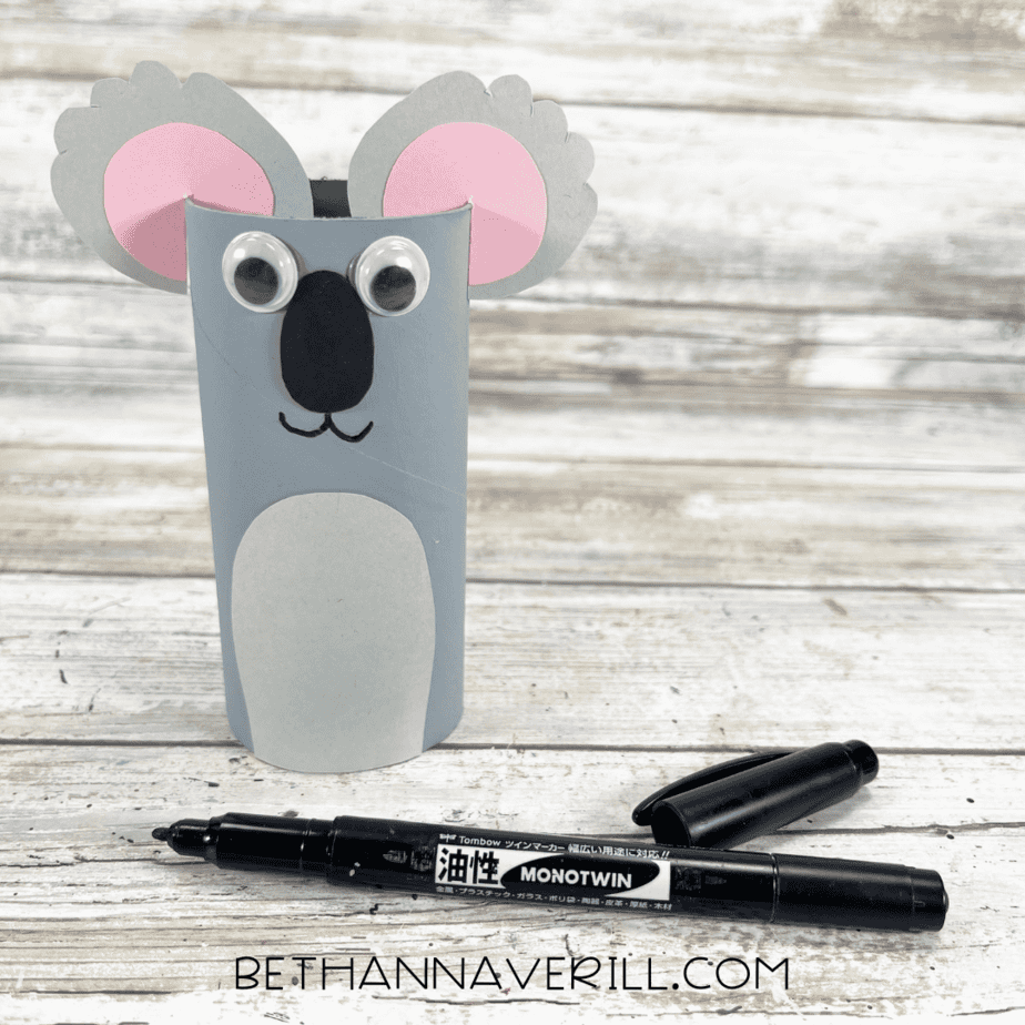 Koala craft with marker-drawn mouth under the nose.