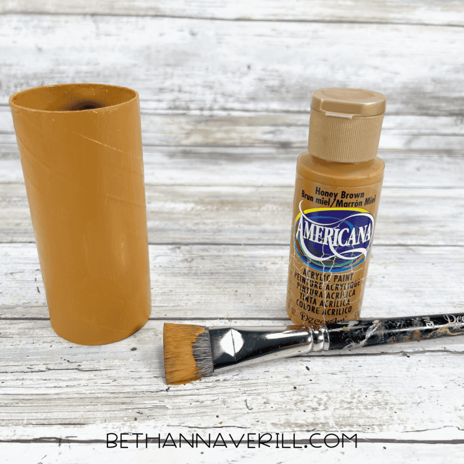 Toilet paper roll painted brown for lion craft base.