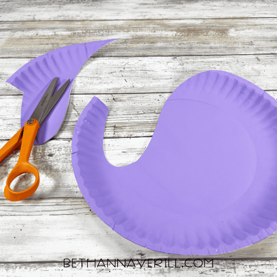 Cut out narwhal body shape from purple painted paper plate.