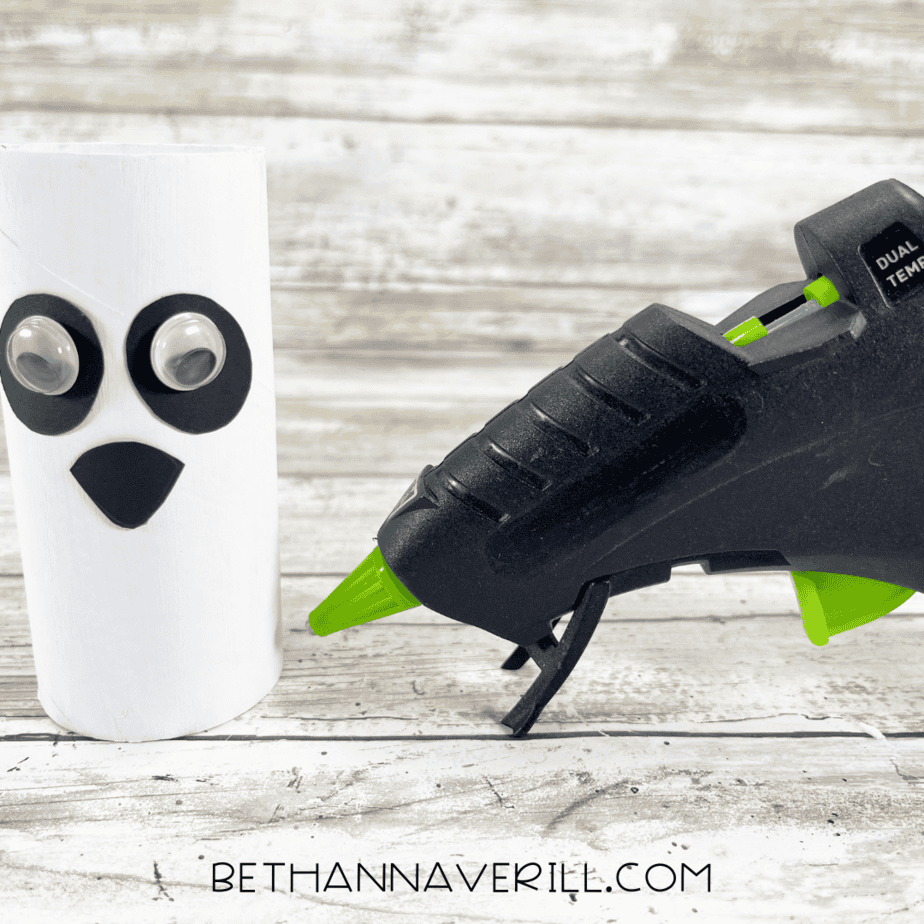 Panda paper roll with glued-on googly eyes and nose piece.