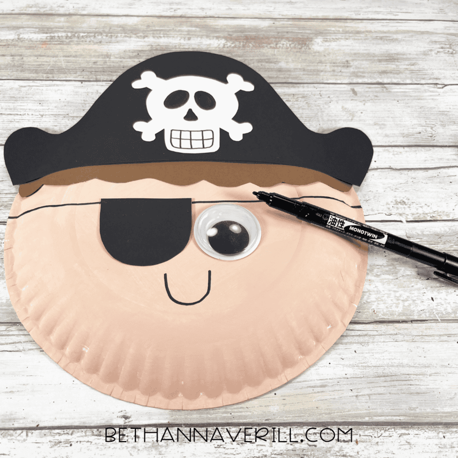 Pirate boy craft with drawn-on smile and eye patch strap.