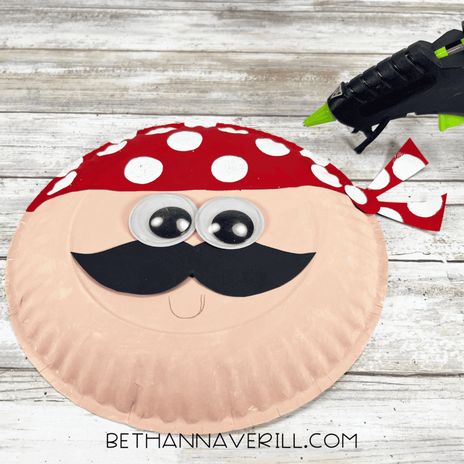 Pirate face with googly eyes, mustache, and red polka-dot bandana attached.