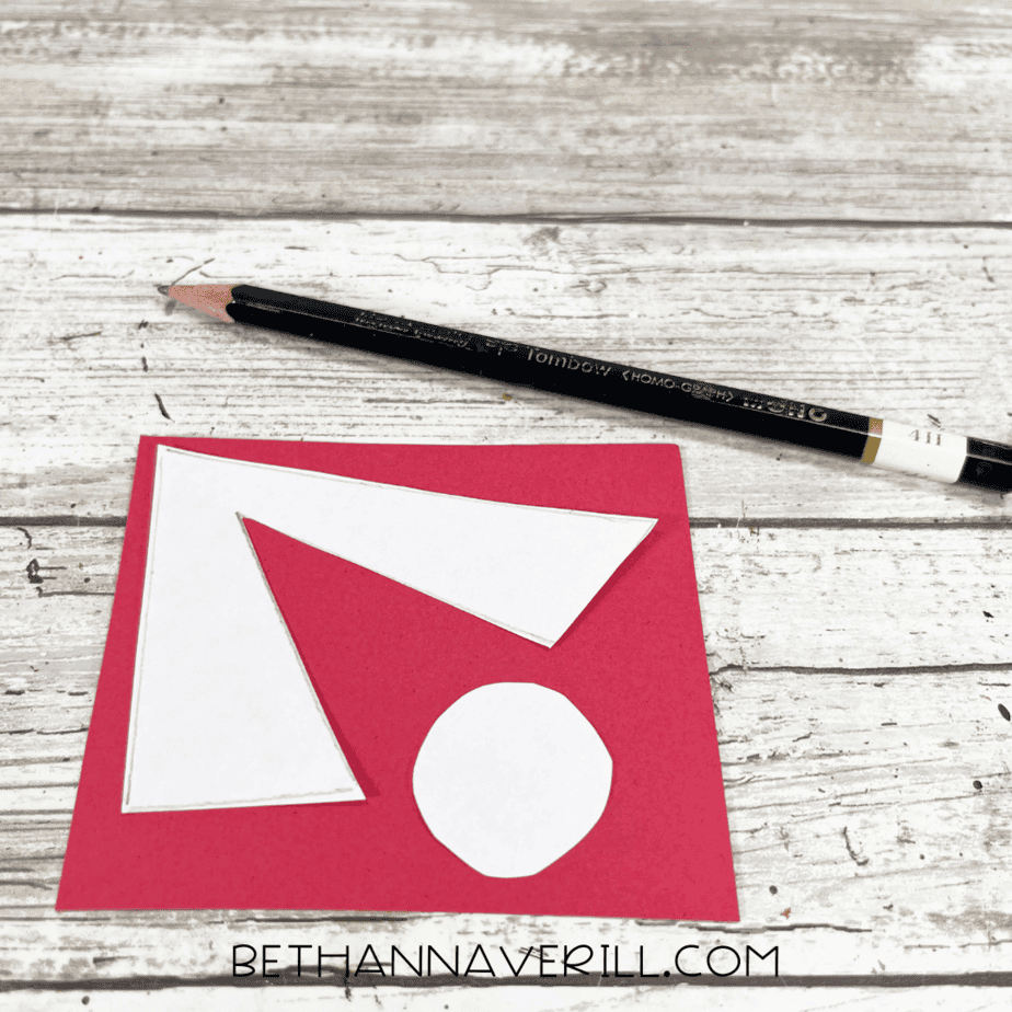 Bandana tie shapes traced on red paper.