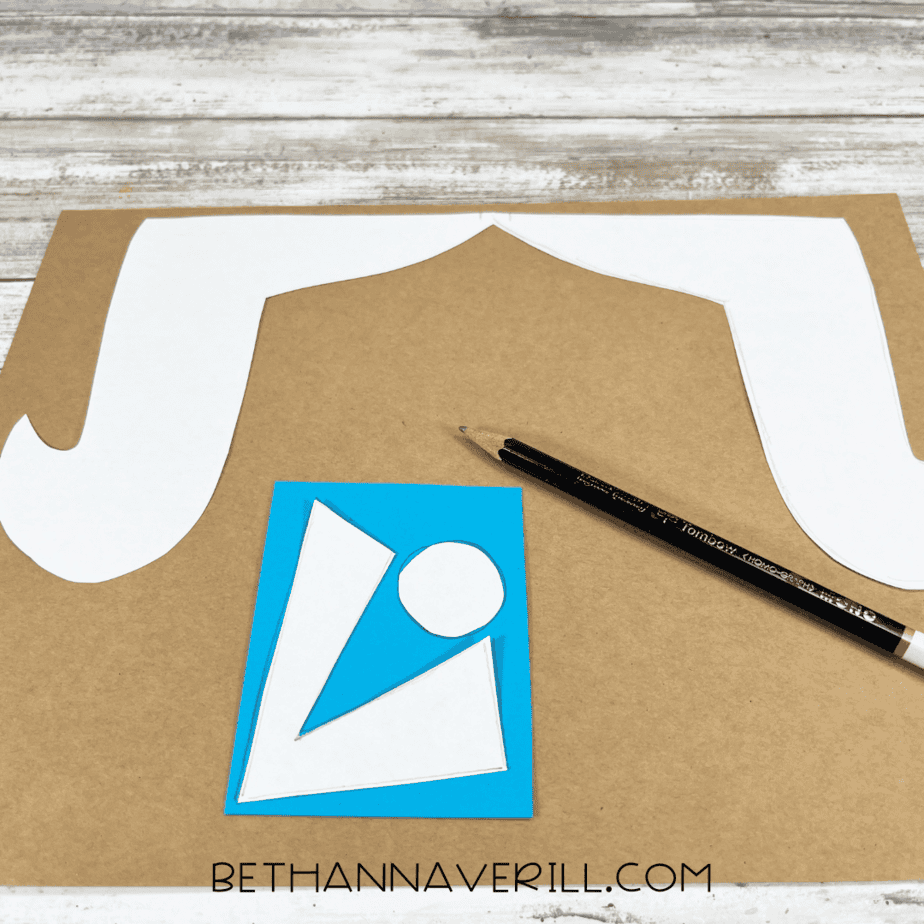 Hair and bandana tie traced onto brown and blue paper.