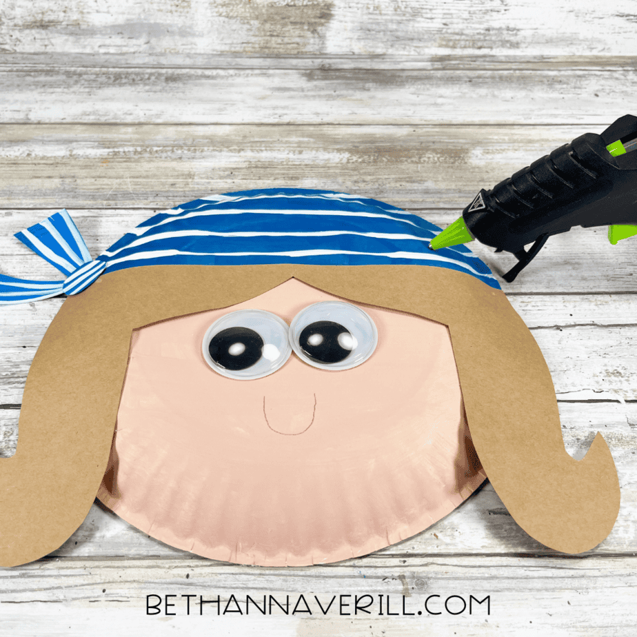 Pirate craft with googly eyes, hair, and striped bandana glued on.