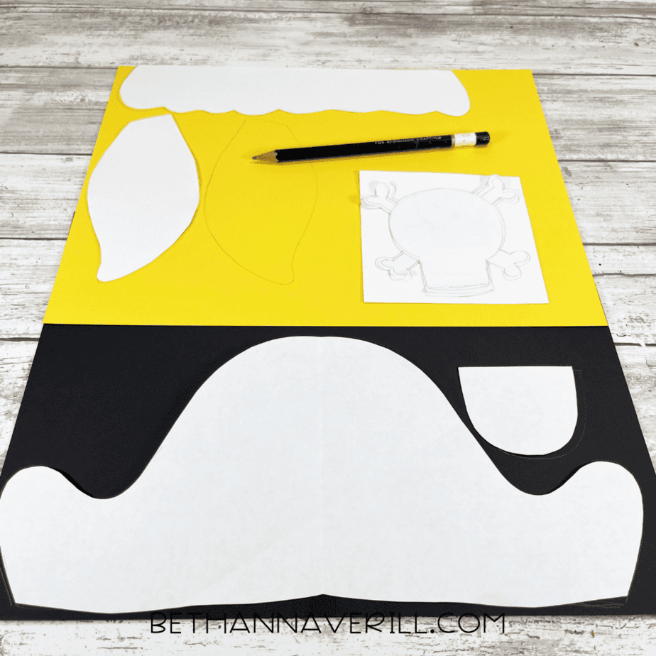 Pirate girl craft templates traced onto yellow and black construction paper.