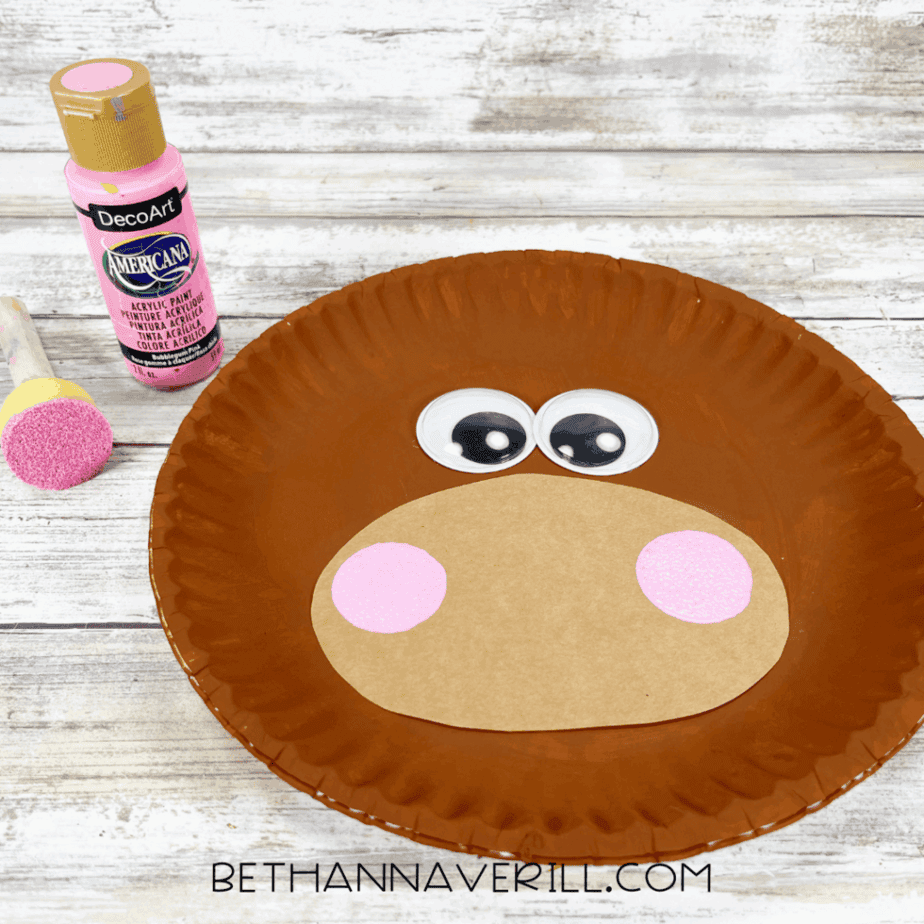 Reindeer face with added pink painted cheeks on the muzzle.