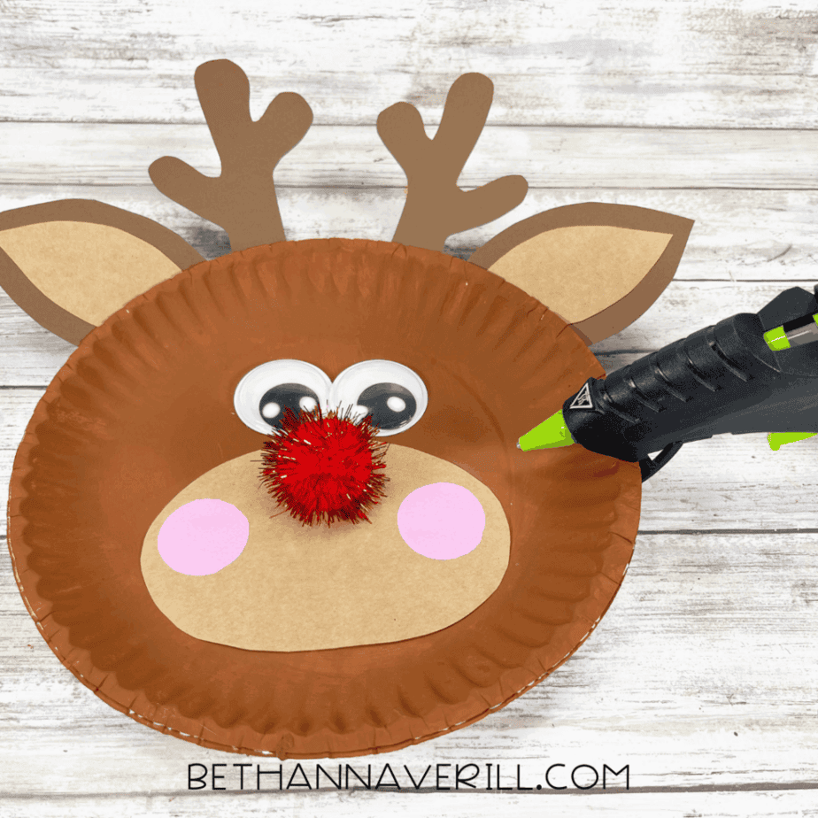 Red pom pom glued in the center for Rudolph’s nose.