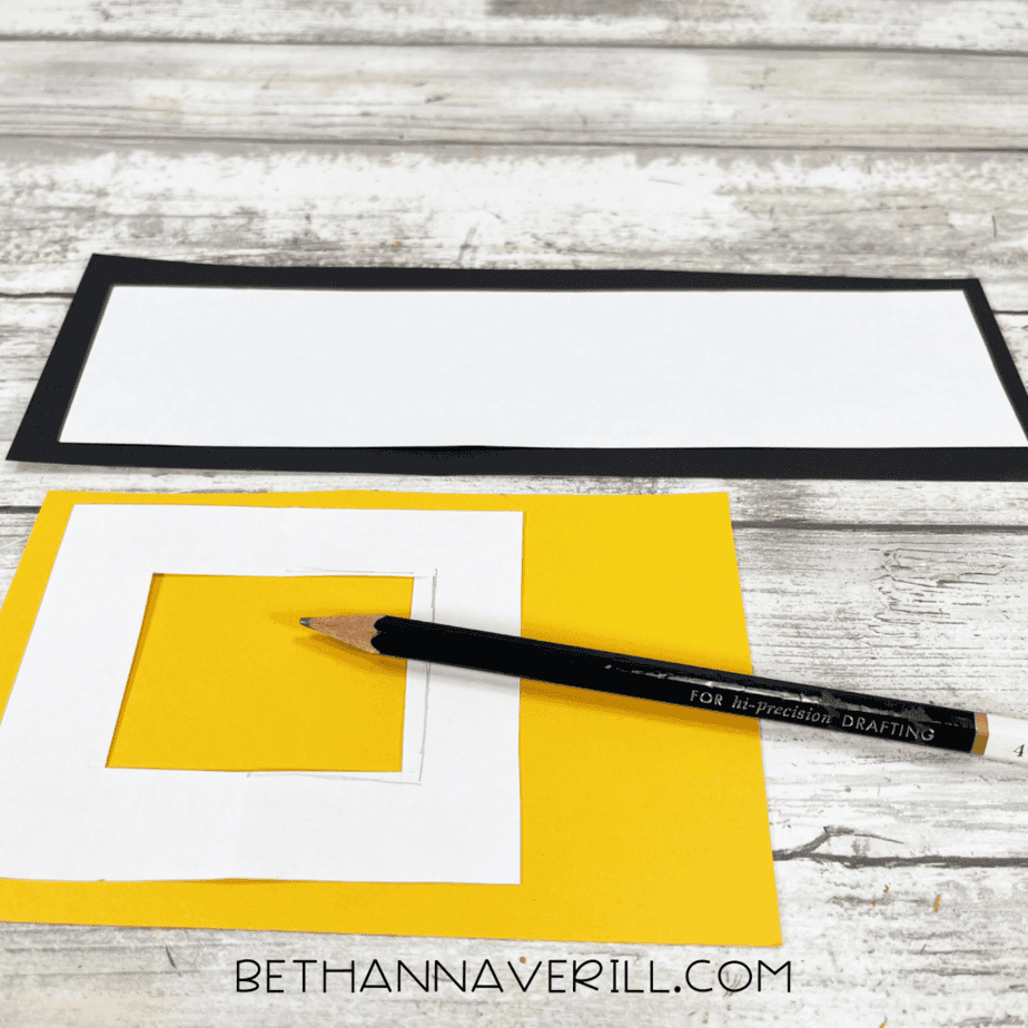 Templates drawn on white paper for belt buckle and belt strip.