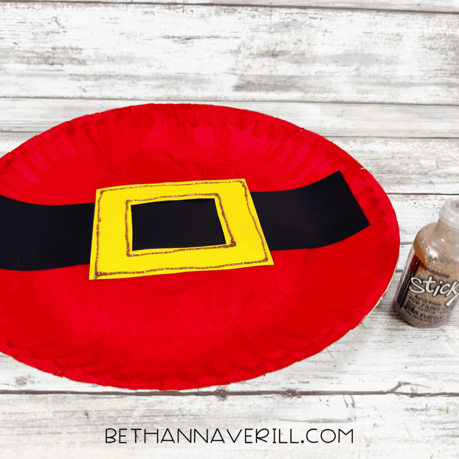 Santa belt buckle outlined with glitter glue for detail.