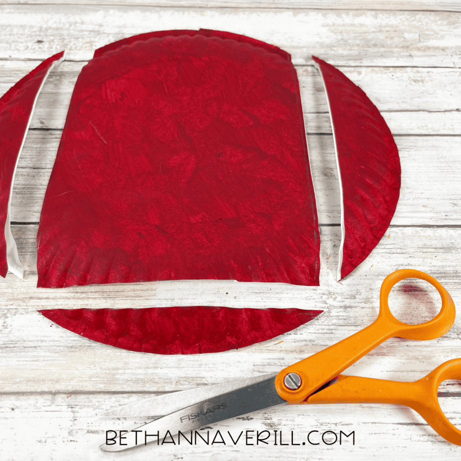 Painted plate cut into a chimney rectangle with scissors.