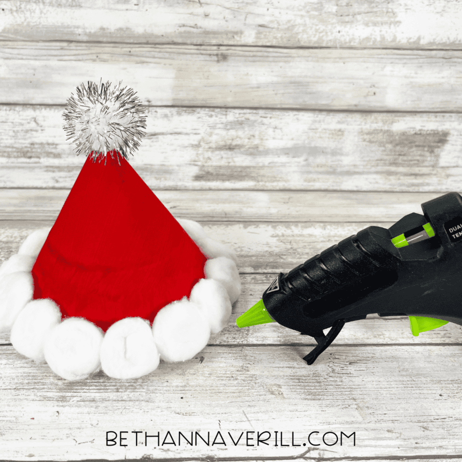 Santa hat with a silver pom-pom glued to the top.