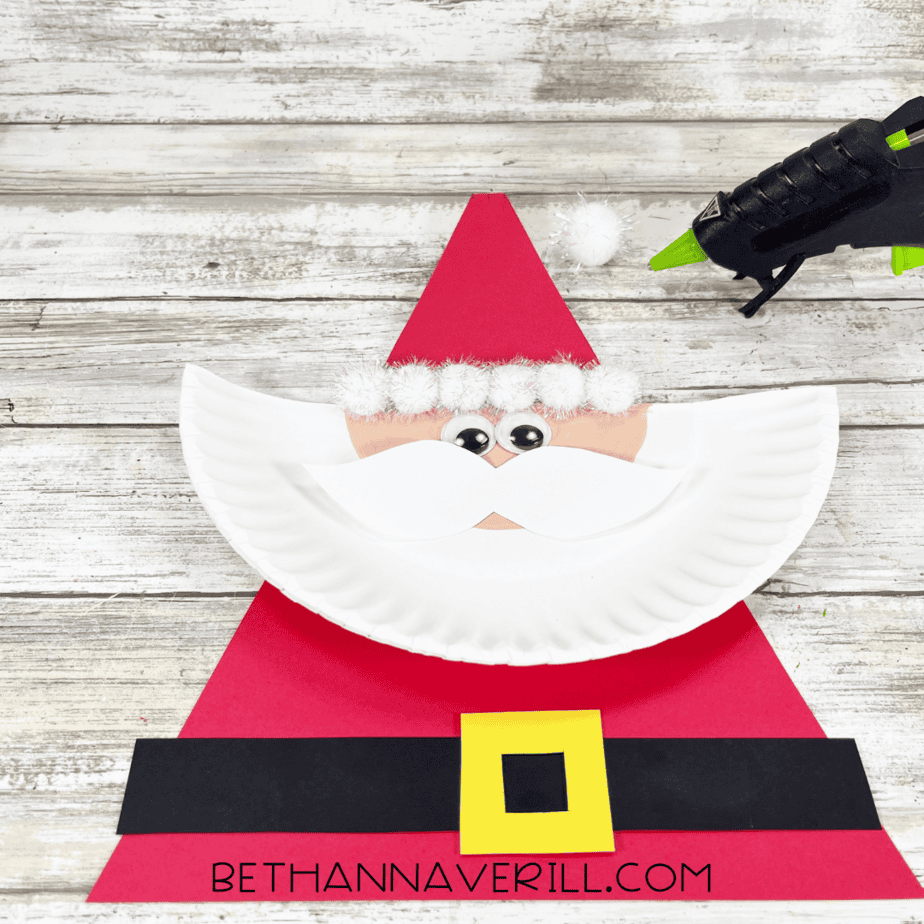 Cotton balls glued across bottom of Santa’s hat as white trim.
