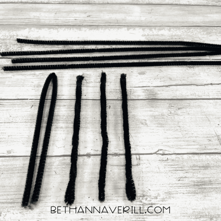 Black pipe cleaners cut into equal pieces for spider legs.