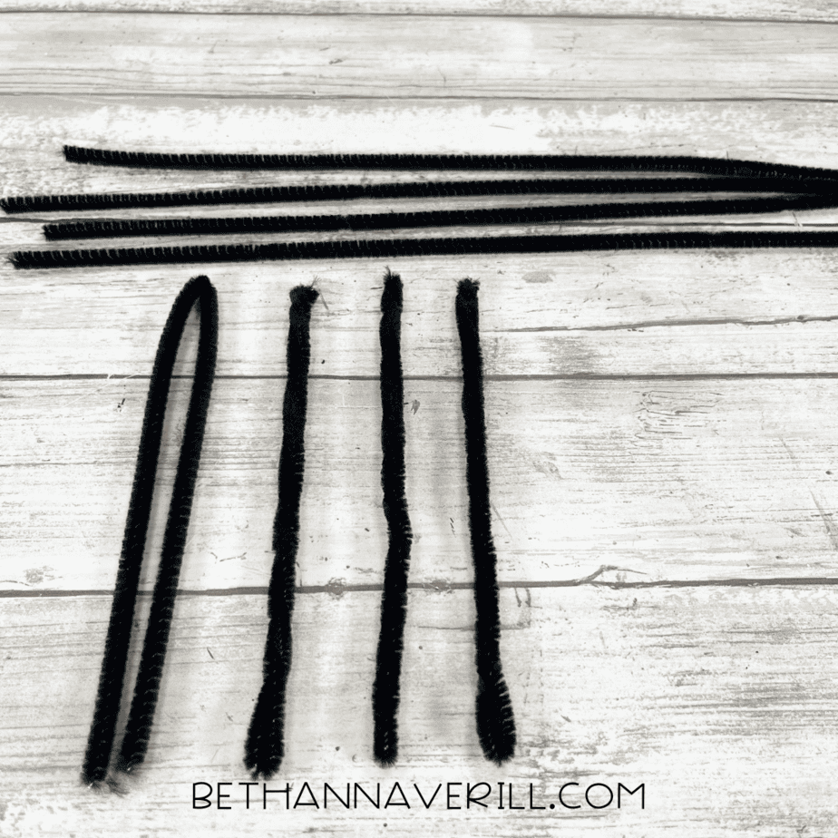 Black pipe cleaners cut into equal pieces for spider legs.