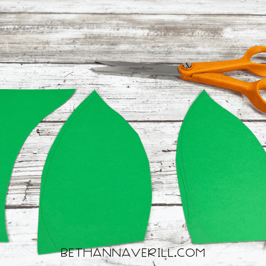 Green leaves cut out with scissors.