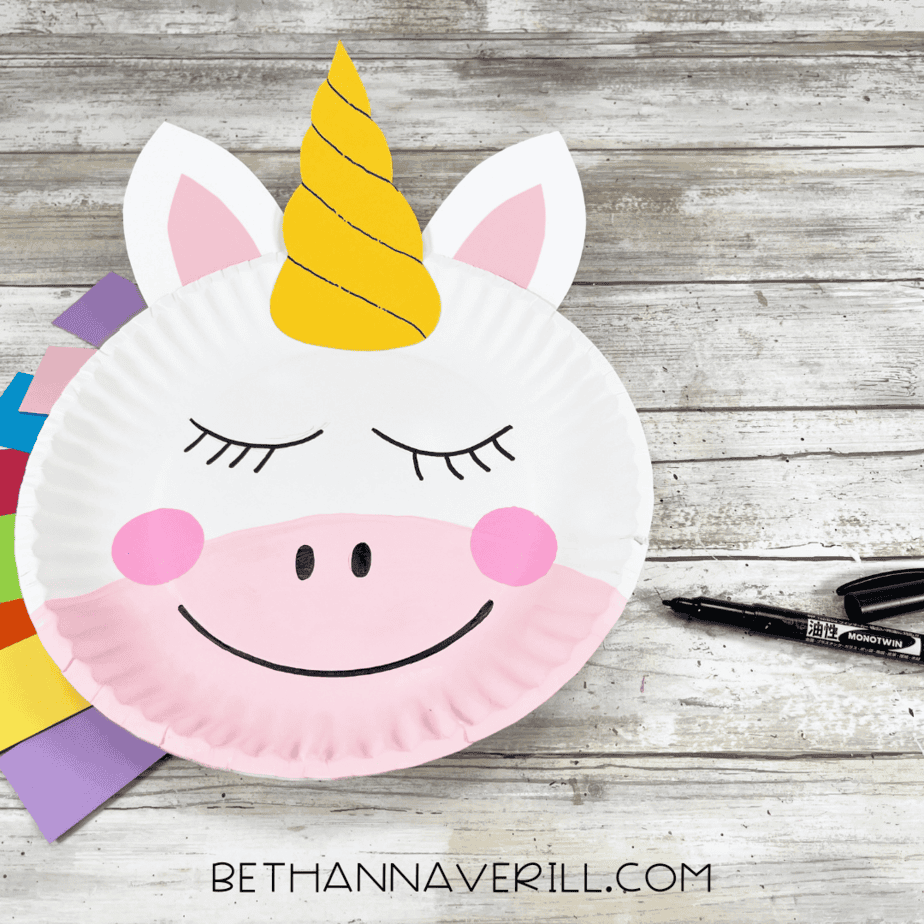 Unicorn face details added with pink cheeks, nose, and eyelashes.