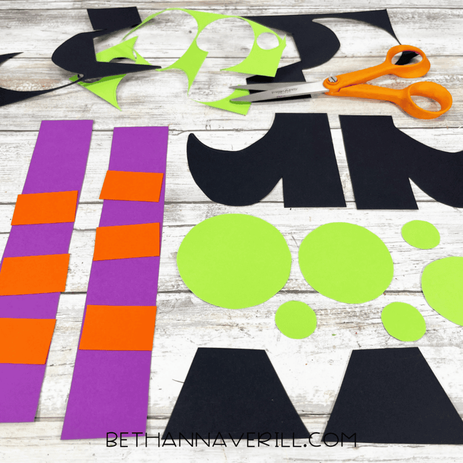 Cut-out shapes for witch legs, boots, bubbles, and stockings.