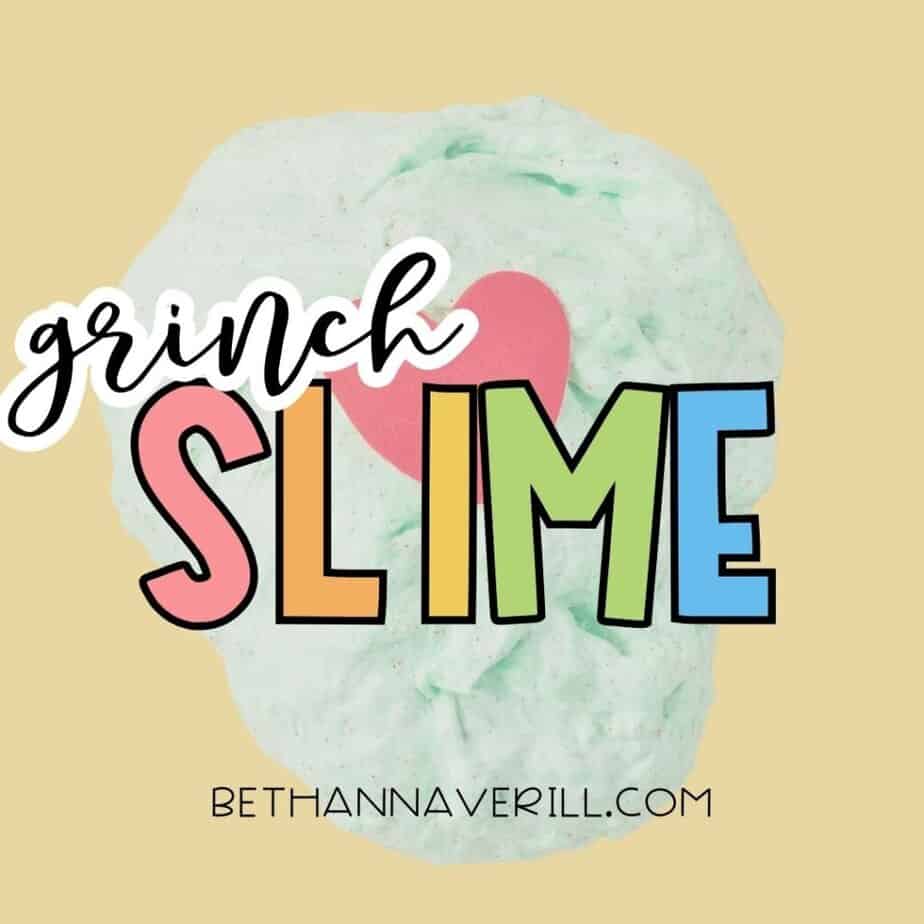 Swirl of light green Grinch slime with a red heart centered on top, set against a yellow background. Bold text overlay reads “Grinch Slime.”