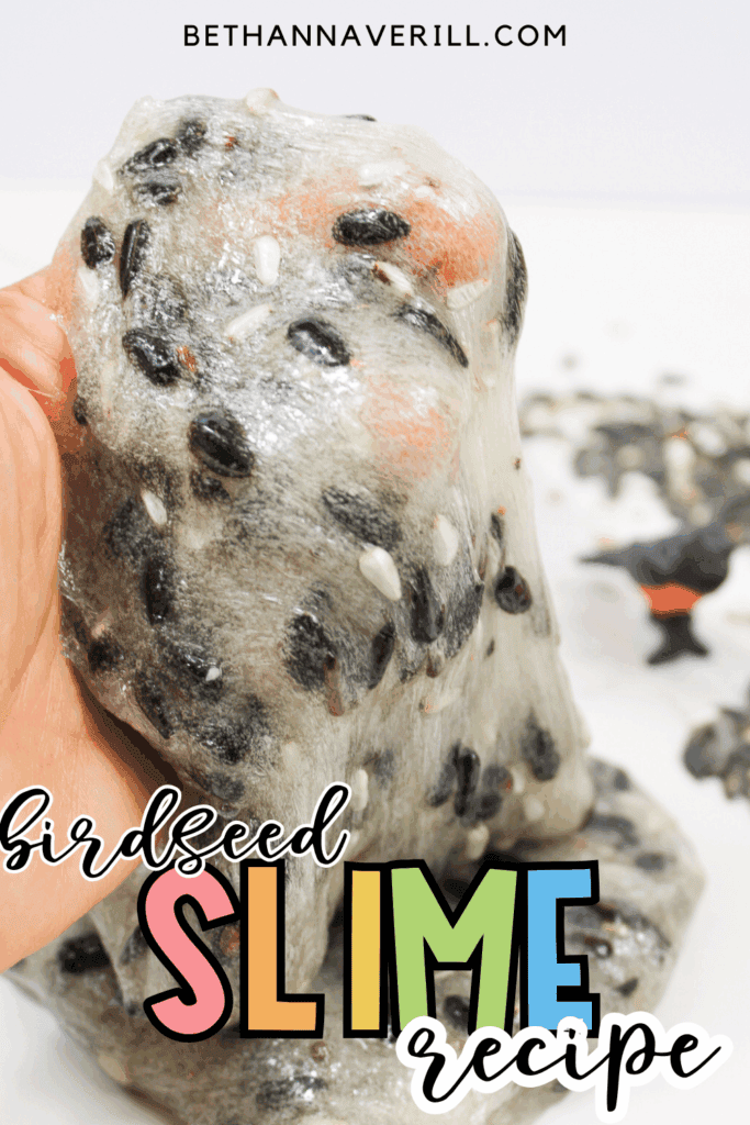 Birdseed slime being stretched by hand with text reading “Birdseed Slime Recipe.”