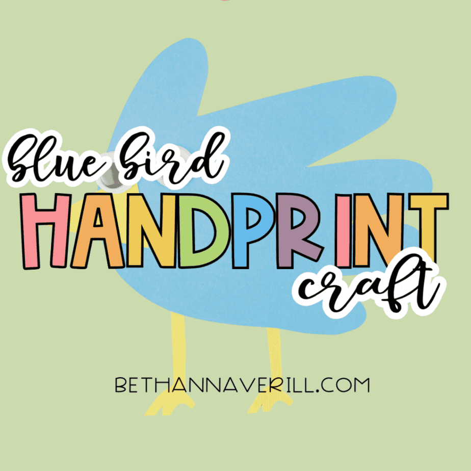 Finished blue bird handprint craft on a green background with text reading “Blue Bird Handprint Craft.”