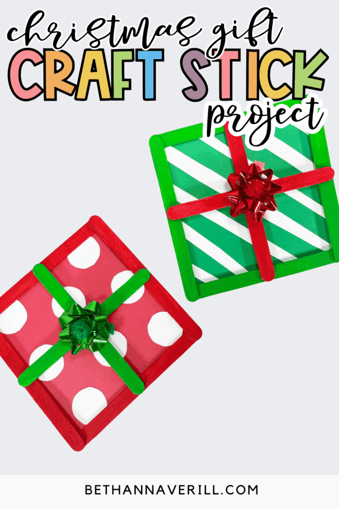 Christmas gift craft stick project featuring two square present decorations made from painted popsicle sticks on a light gray background with the text “Christmas gift craft stick project.”