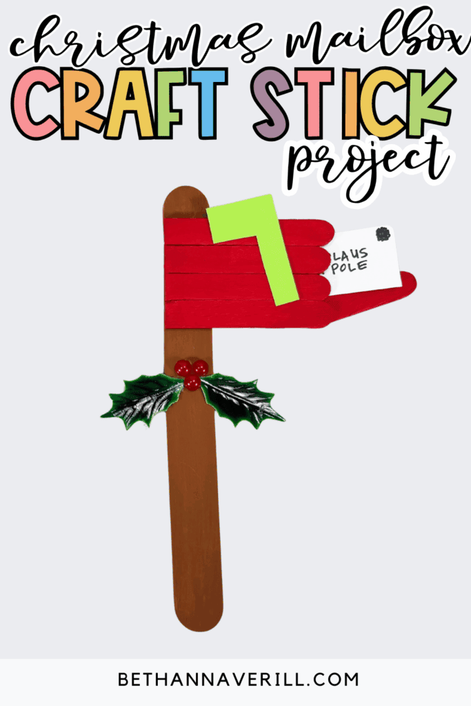 Christmas mailbox craft stick project featuring a red popsicle stick mailbox with a green flag and a small white letter, with decorative holly and the text “Christmas mailbox craft stick project.”