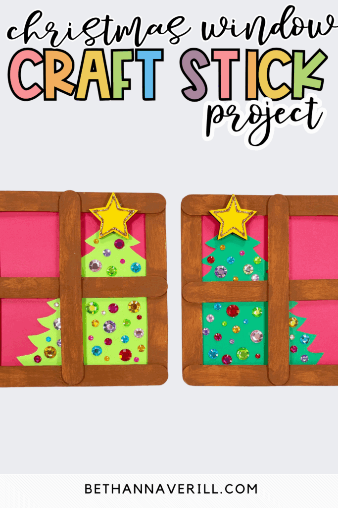 Christmas window popsicle stick craft title image showing two brown craft stick windows with decorated Christmas trees behind them on a light background.