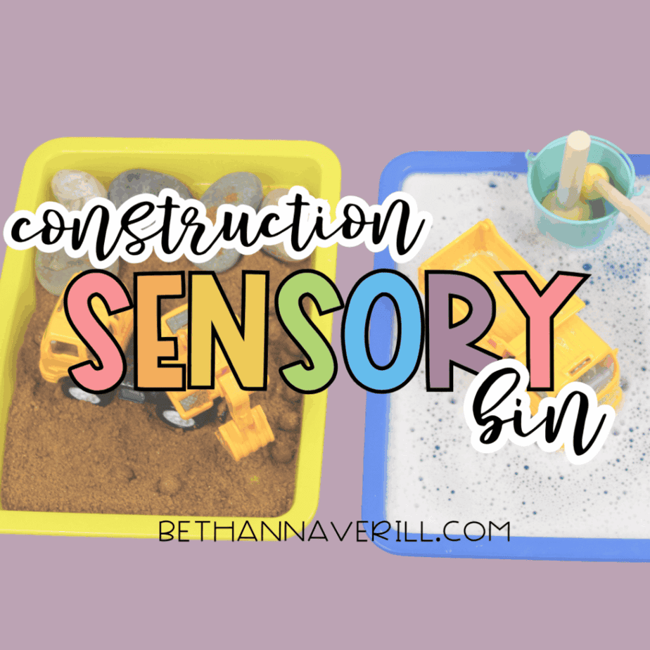 Construction sensory bin with toy trucks playing in sand and bubbly water trays on a purple background.