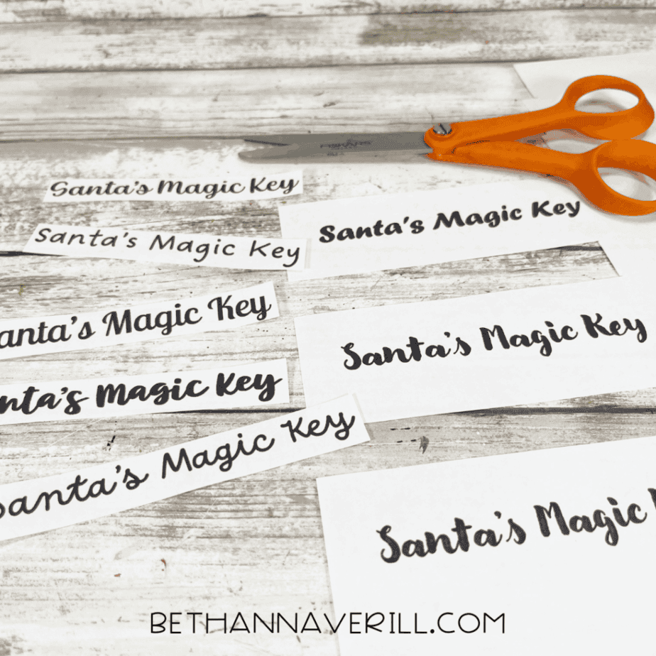 Printed Santa’s Magic Key labels cut into strips and ready to glue onto popsicle stick keys.